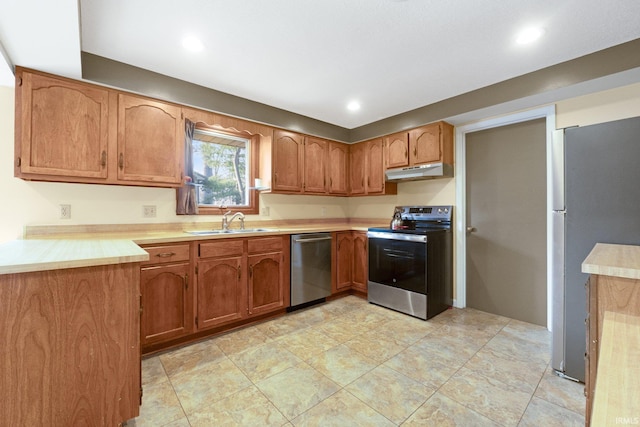 kitchen featuring appliances with stainless steel finishes and sink