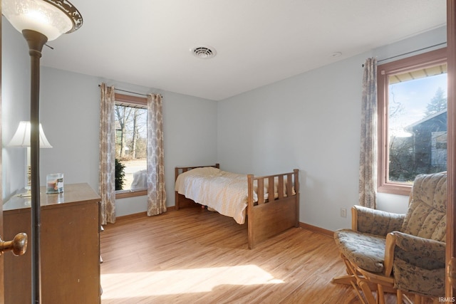 bedroom with light wood-type flooring