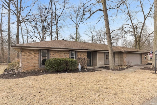 single story home featuring a garage and a front yard