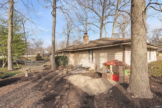 view of property exterior with a patio area