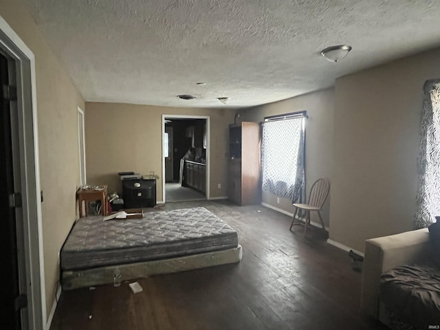 interior space with hardwood / wood-style flooring and a textured ceiling