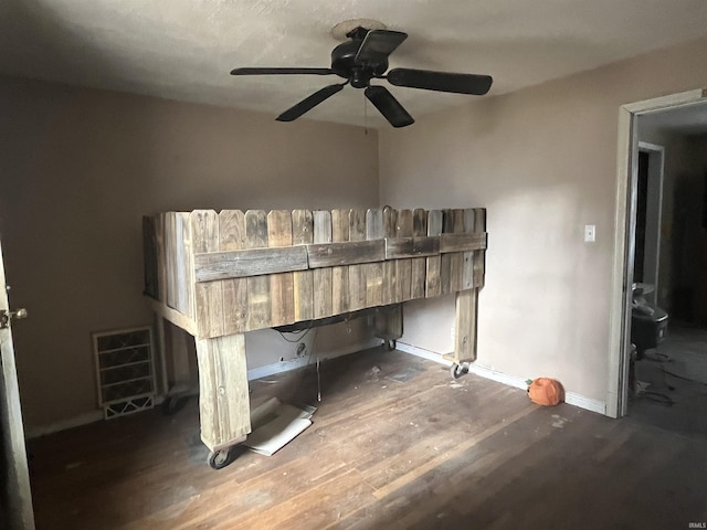 bedroom with dark hardwood / wood-style flooring