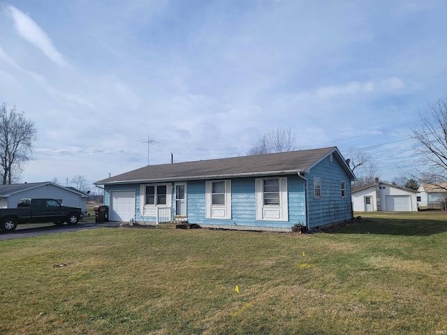 single story home featuring a garage and a front yard