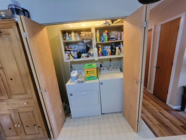 laundry area featuring washing machine and clothes dryer