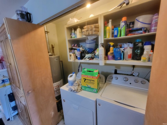 laundry room with washer and clothes dryer and gas water heater