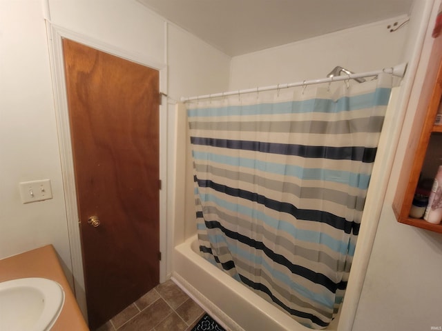 bathroom featuring sink and shower / bathtub combination with curtain