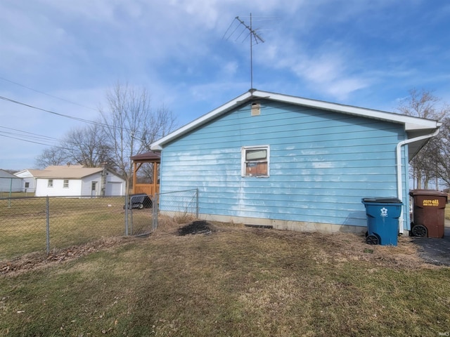 view of home's exterior with a yard