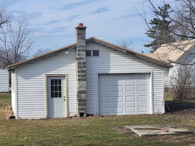 garage with a lawn