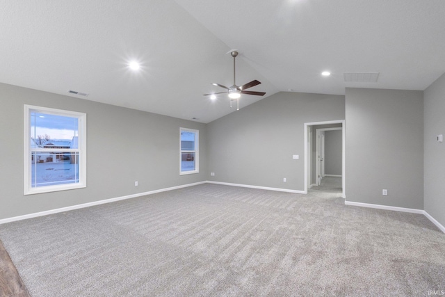 unfurnished room with lofted ceiling, light carpet, and ceiling fan