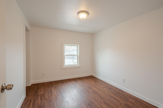 unfurnished room featuring dark hardwood / wood-style floors