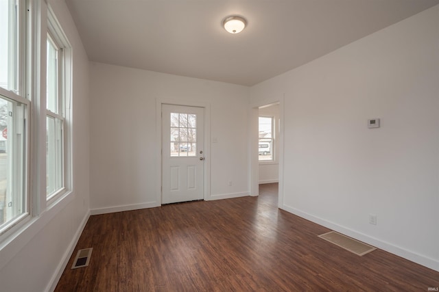 interior space with dark hardwood / wood-style floors