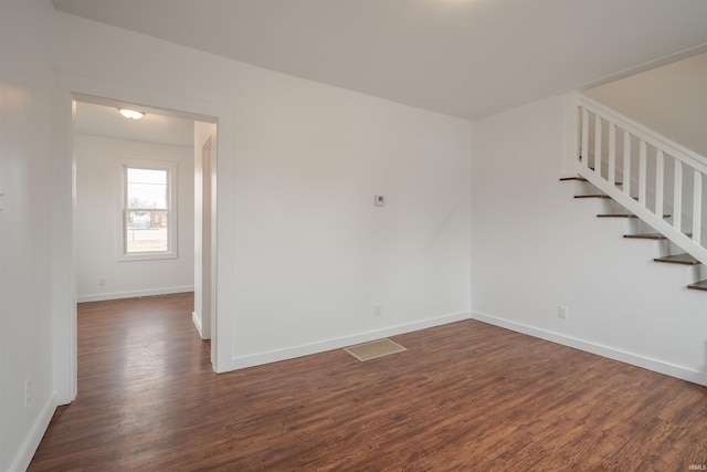 unfurnished room featuring dark hardwood / wood-style floors