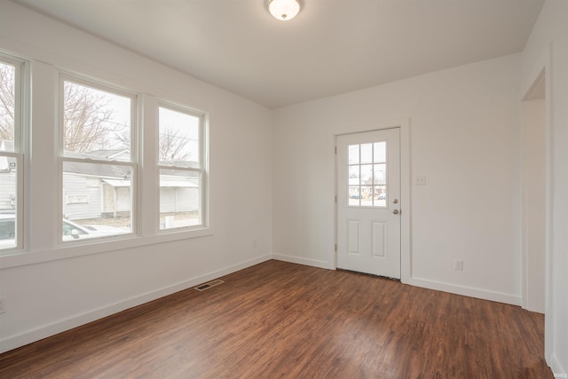 spare room with dark wood-type flooring