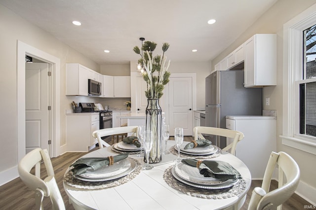 dining area with hardwood / wood-style floors