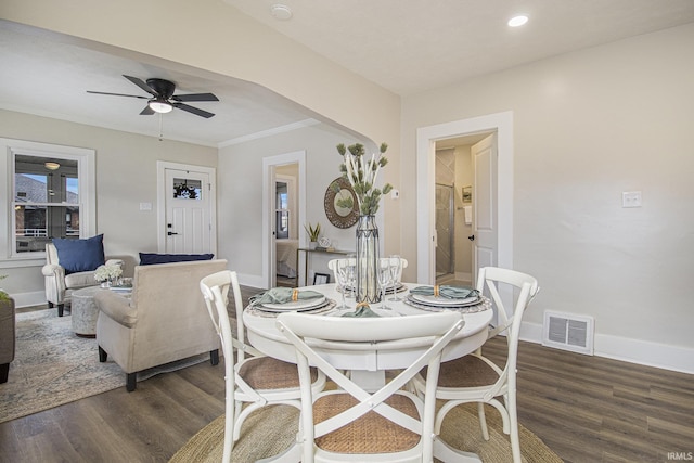 dining area featuring crown molding, dark hardwood / wood-style floors, and ceiling fan