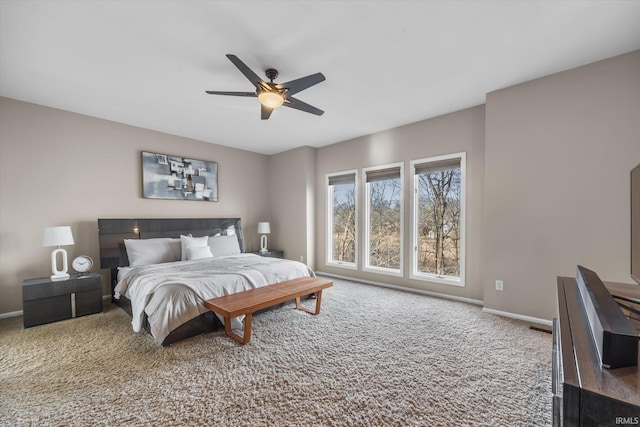 bedroom featuring ceiling fan and carpet