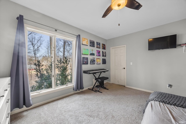 bedroom with ceiling fan and carpet flooring