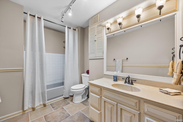 full bathroom with shower / tub combo with curtain, vanity, rail lighting, and toilet