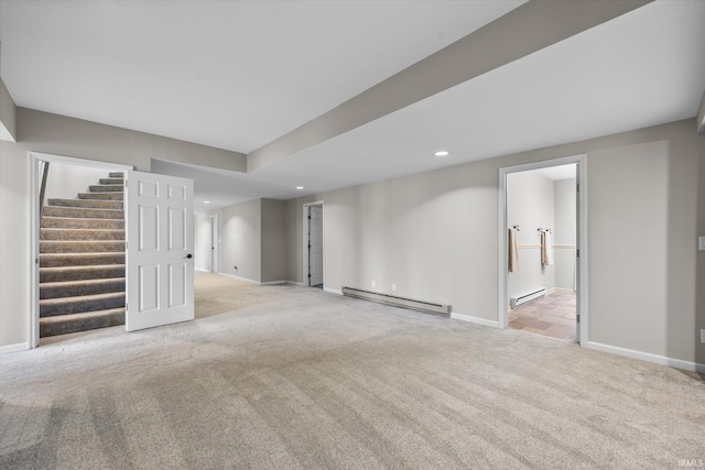 basement featuring a baseboard radiator and light carpet