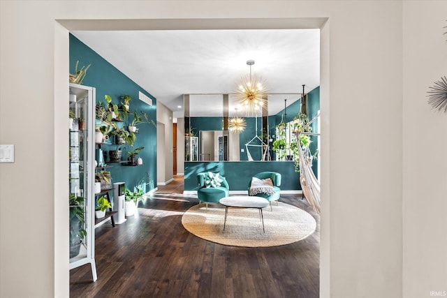 living room featuring wood-type flooring and a notable chandelier