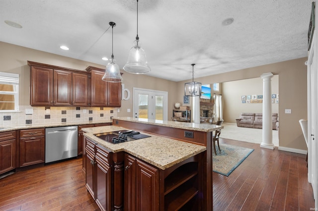 kitchen featuring decorative light fixtures, decorative columns, dishwasher, a center island, and black electric stovetop