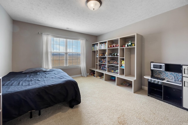 carpeted bedroom with a textured ceiling