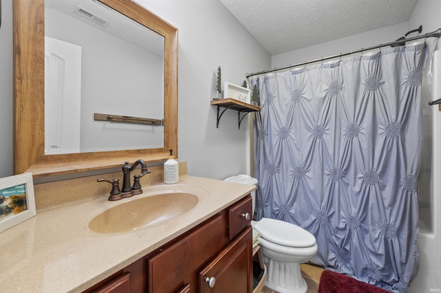 bathroom with vanity, toilet, a textured ceiling, and a shower with shower curtain