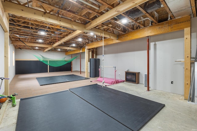 exercise area featuring water heater