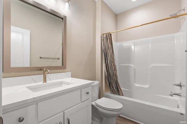 full bathroom with vanity, wood-type flooring, shower / bath combination with curtain, and toilet