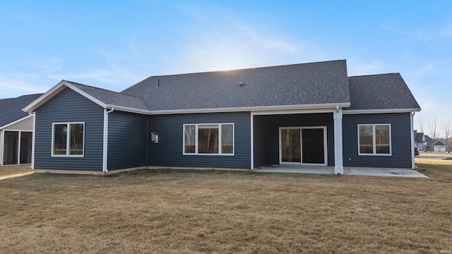 rear view of property with a patio area and a lawn