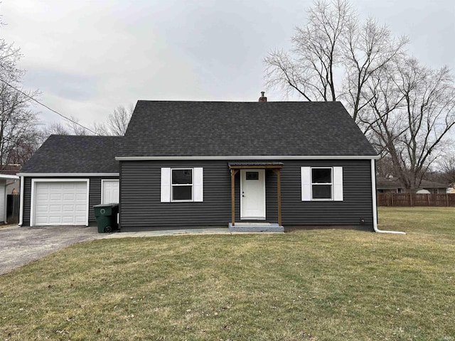 view of front of home featuring a garage and a front lawn