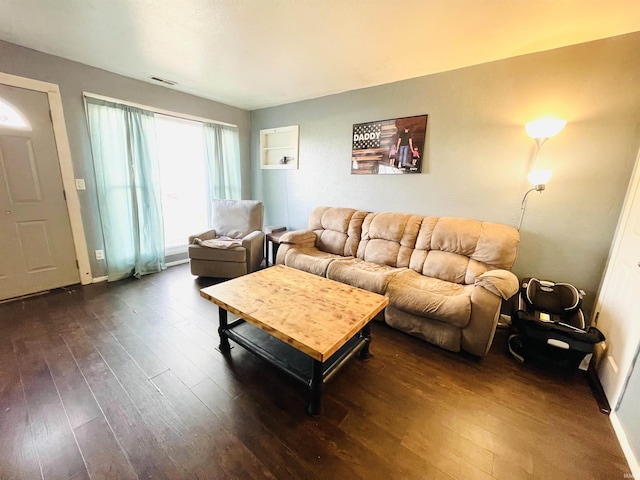 living room with dark wood-type flooring