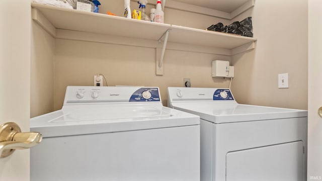 washroom with washing machine and dryer