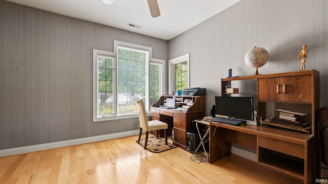 office area with ceiling fan and light hardwood / wood-style floors