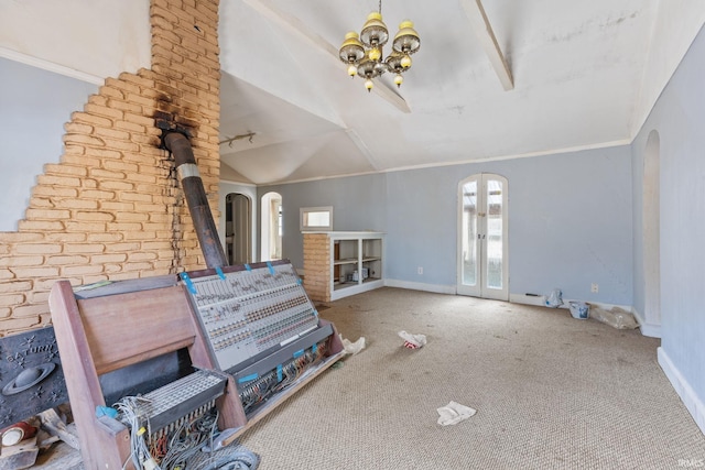 unfurnished living room with french doors, ornamental molding, lofted ceiling, and carpet flooring