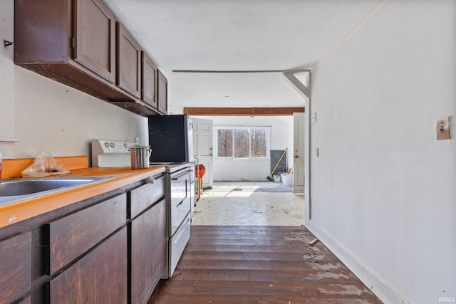 kitchen featuring dark hardwood / wood-style flooring, sink, dark brown cabinetry, and white range with electric cooktop