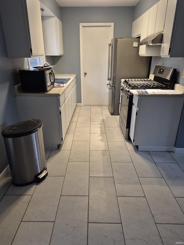 kitchen with white cabinetry and appliances with stainless steel finishes