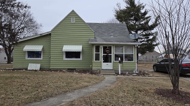 bungalow with a front lawn