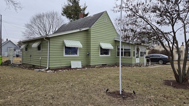 view of side of home with a chimney