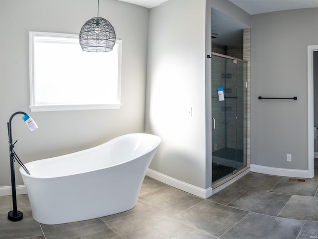 bathroom featuring independent shower and bath and tile patterned floors