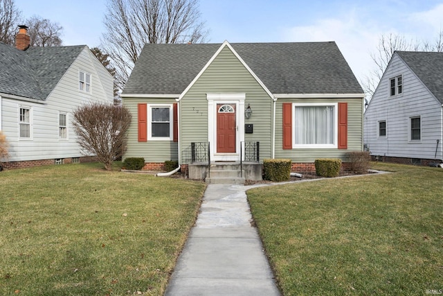 bungalow-style home with a front lawn