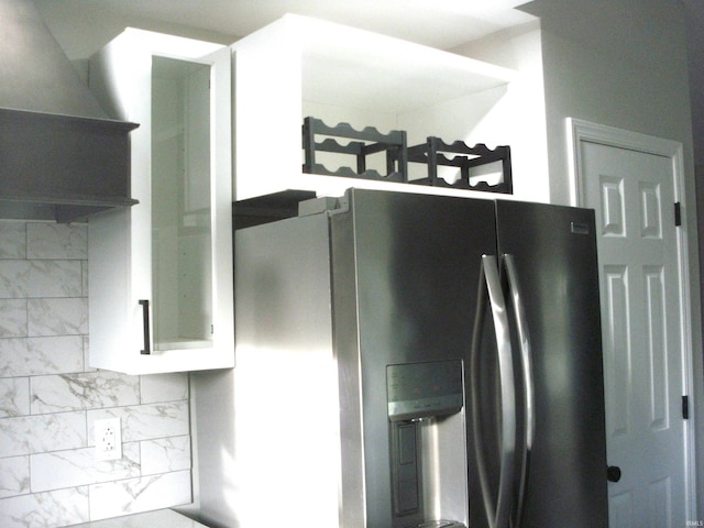 kitchen with tasteful backsplash and stainless steel fridge with ice dispenser