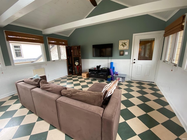 living room featuring vaulted ceiling with beams