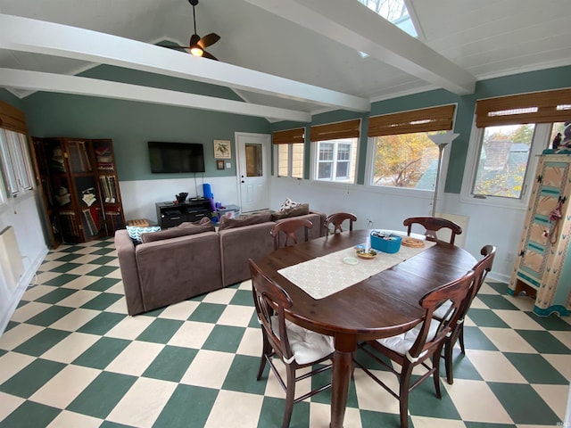 dining space featuring lofted ceiling with beams and ceiling fan