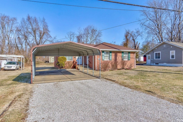 view of car parking with a carport and a yard