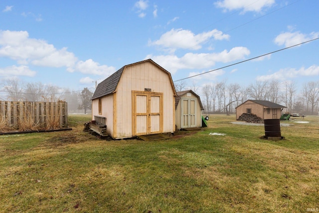 view of outbuilding with a yard