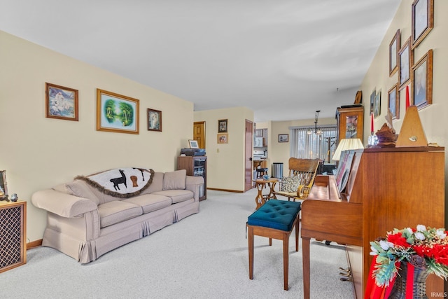 living room with light colored carpet and a chandelier