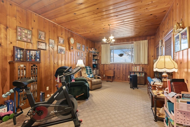 interior space featuring wood walls, a chandelier, and wooden ceiling