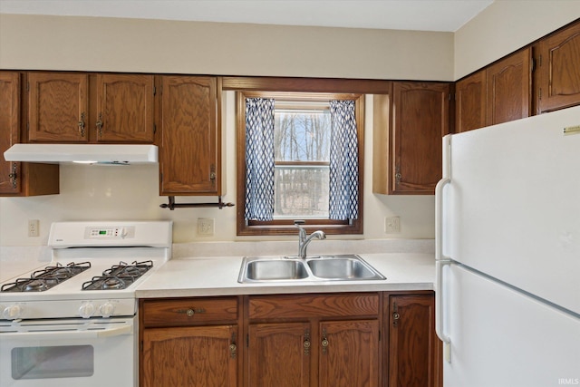 kitchen with sink and white appliances