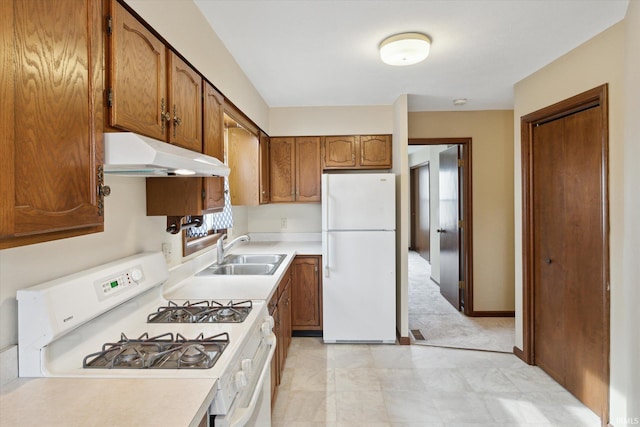 kitchen featuring white appliances and sink